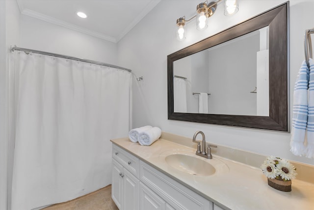 bathroom featuring tile patterned flooring, vanity, and crown molding