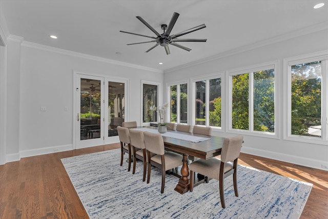 dining area featuring ceiling fan, dark hardwood / wood-style floors, and ornamental molding