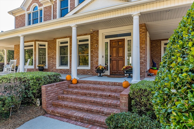 property entrance with covered porch