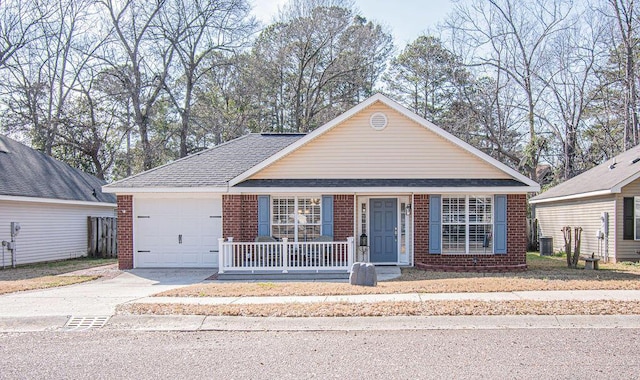 view of front of home with driveway, an attached garage, covered porch, central AC, and brick siding