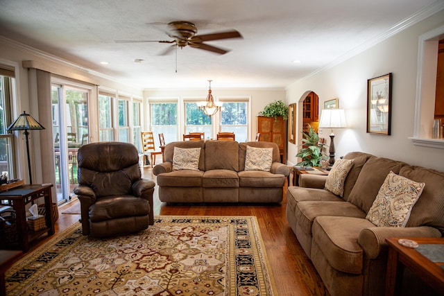 6287 Rousseau Creek Rd, Thomson, GA 30824 - living room with ceiling fan, wood finished floors, ornamental molding, arched walkways, and a chandelier