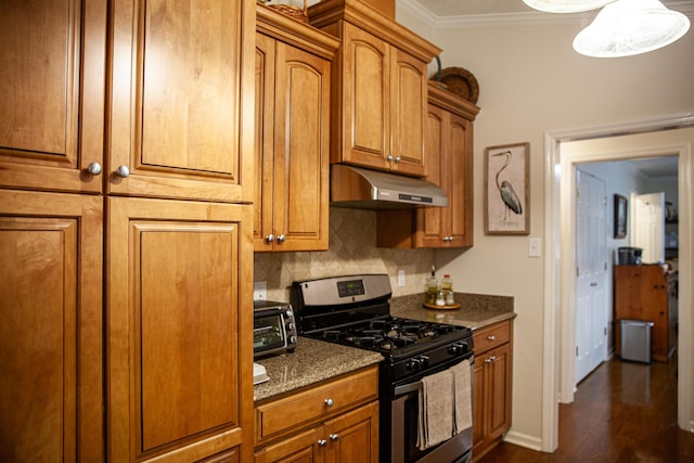 6287 Rousseau Creek Rd, Thomson, GA 30824 - kitchen featuring stainless steel range with gas stovetop, under cabinet range hood, crown molding, brown cabinets, and dark wood-style floors