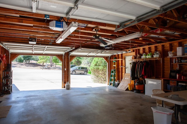 6287 Rousseau Creek Rd, Thomson, GA 30824 - garage featuring fridge and a garage door opener