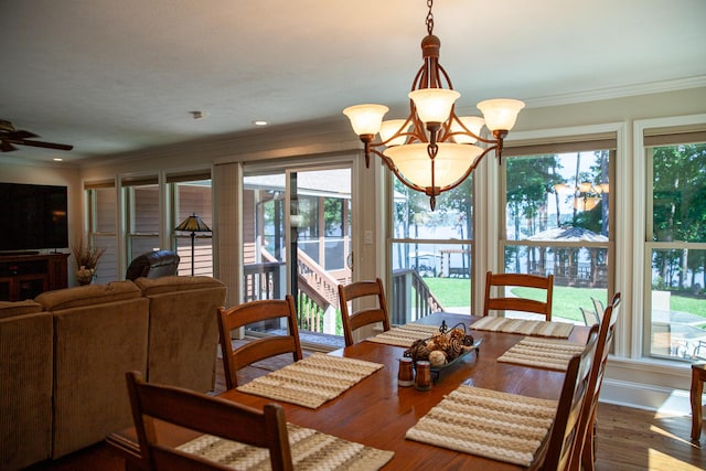 6287 Rousseau Creek Rd, Thomson, GA 30824 - dining room with crown molding, wood finished floors, and a ceiling fan