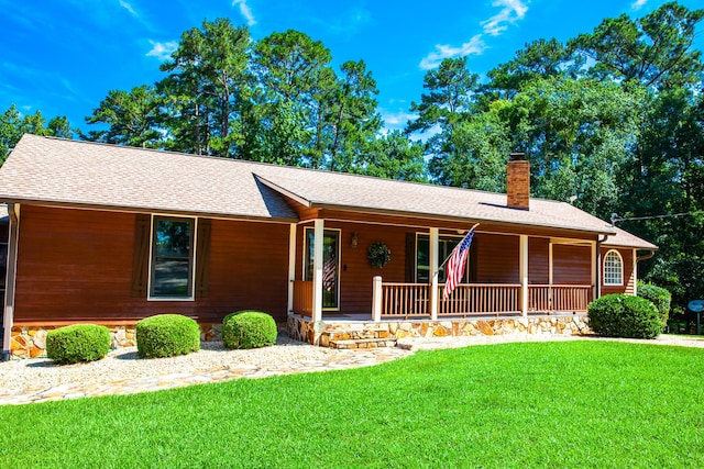 6287 Rousseau Creek Rd, Thomson, GA 30824 - ranch-style home with a chimney, a porch, a shingled roof, and a front yard