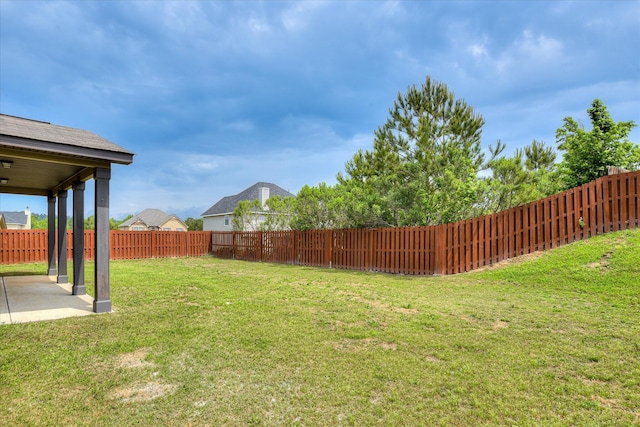 view of yard featuring a patio and a fenced backyard