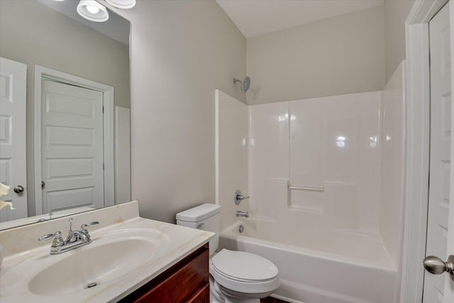 bathroom featuring toilet, shower / bathtub combination, and vanity