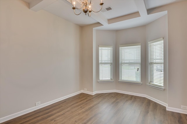 empty room with beamed ceiling, visible vents, baseboards, dark wood-type flooring, and a notable chandelier