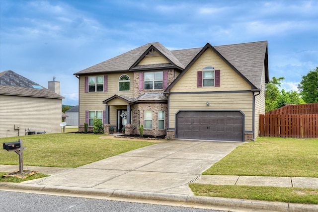 craftsman-style house with a front yard, roof with shingles, concrete driveway, an attached garage, and fence