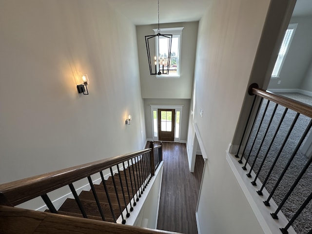 2417 Laurens St, Grovetown, GA 30813 - stairs featuring a chandelier, wood finished floors, baseboards, and a towering ceiling