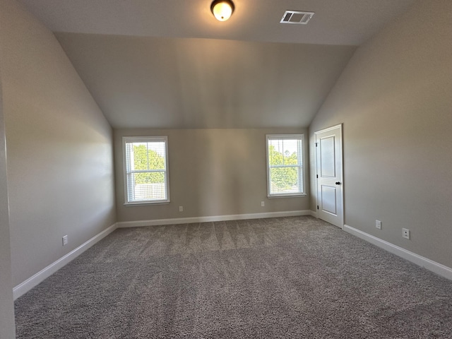 2417 Laurens St, Grovetown, GA 30813 - spare room featuring lofted ceiling, plenty of natural light, carpet floors, and baseboards