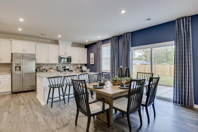 2027 Saylor Ln, Grovetown, GA 30813 - dining space featuring light wood-style floors and recessed lighting