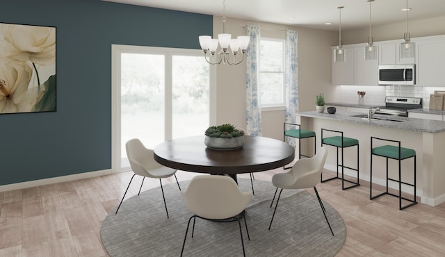 2027 Saylor Ln, Grovetown, GA 30813 - dining space with a chandelier, light wood-type flooring, and recessed lighting