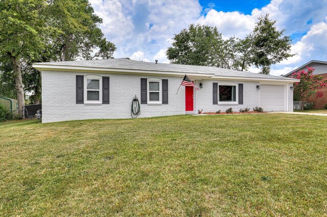4073 Old Trail Rd, Augusta, GA 30907 - ranch-style home featuring brick siding, a garage, a front lawn, and driveway