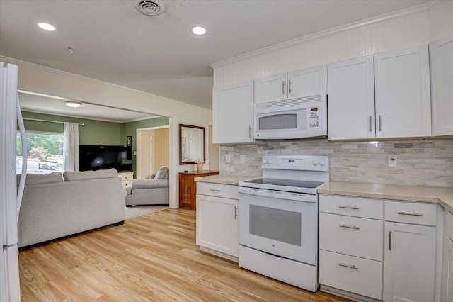 4073 Old Trail Rd, Augusta, GA 30907 - kitchen featuring white appliances, crown molding, open floor plan, decorative backsplash, and light countertops