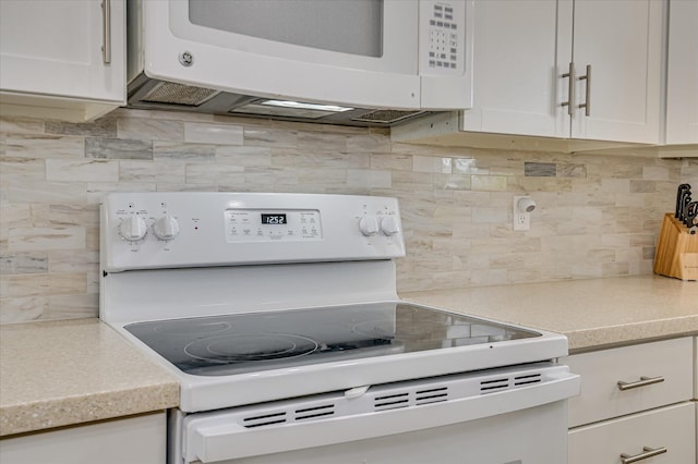 4073 Old Trail Rd, Augusta, GA 30907 - kitchen with white appliances, tasteful backsplash, light countertops, and white cabinetry