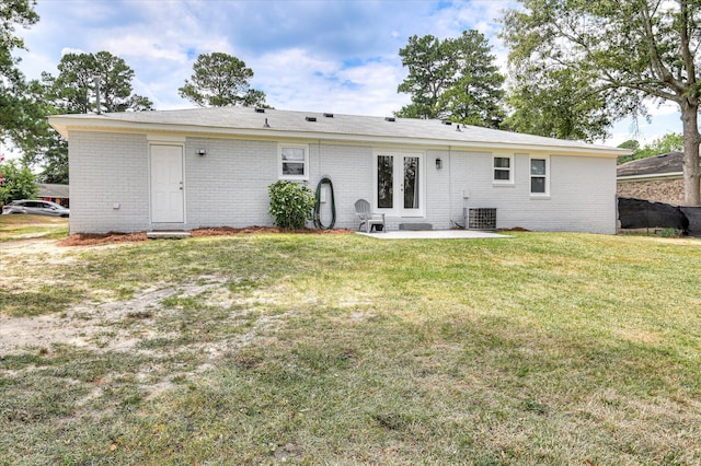 4073 Old Trail Rd, Augusta, GA 30907 - rear view of house featuring brick siding, a patio area, a lawn, and french doors