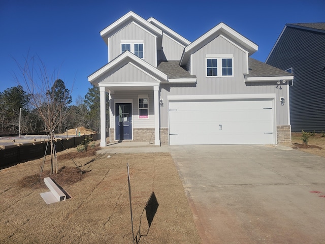 craftsman inspired home with a porch and a garage