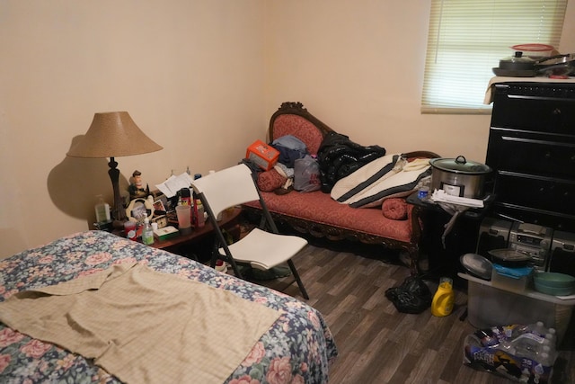 bedroom featuring dark hardwood / wood-style flooring