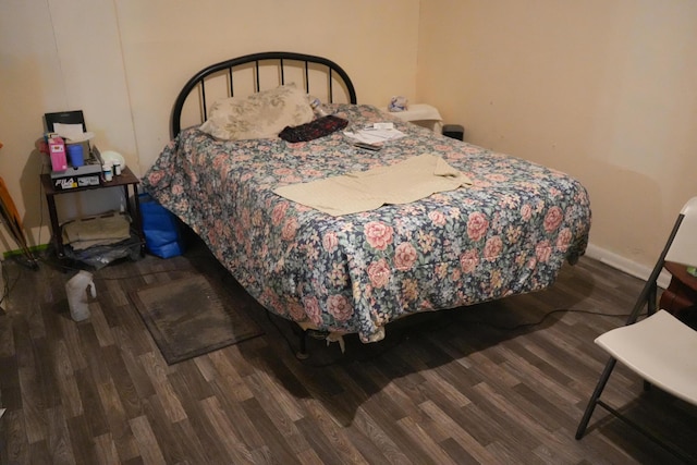 bedroom featuring dark hardwood / wood-style floors