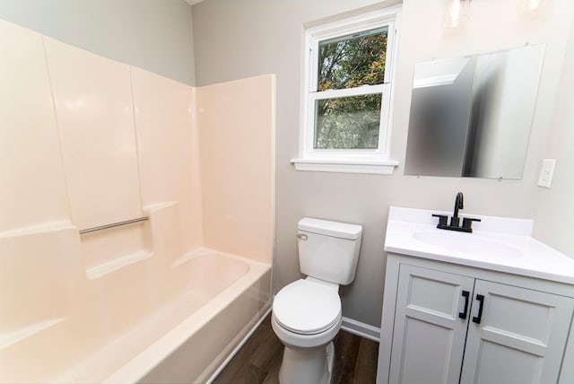 full bathroom featuring shower / tub combination, vanity, toilet, and hardwood / wood-style floors