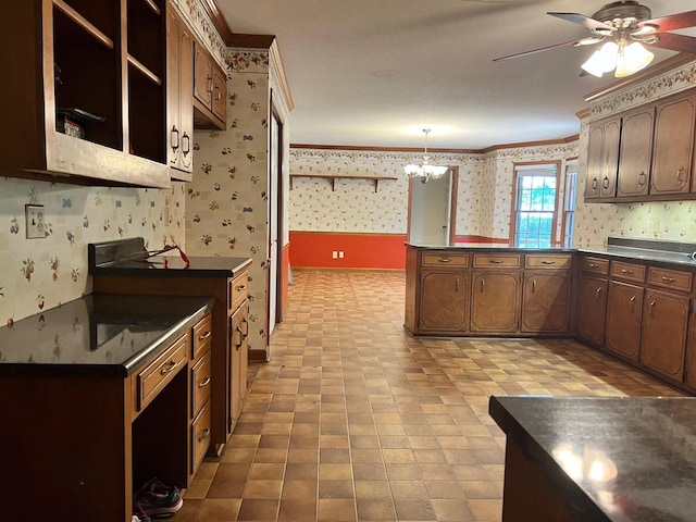 kitchen with ceiling fan with notable chandelier, range with electric stovetop, ornamental molding, and decorative light fixtures