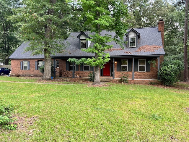 cape cod house featuring a front yard and a porch