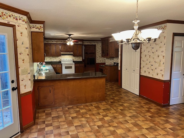 kitchen featuring pendant lighting, white range with electric cooktop, ceiling fan with notable chandelier, ornamental molding, and kitchen peninsula