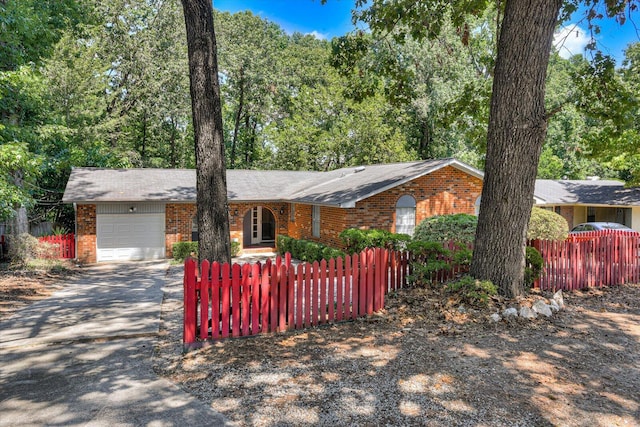 single story home featuring a garage