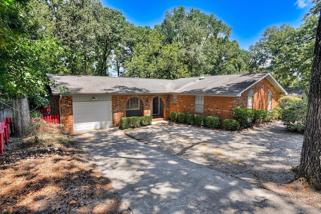 single story home featuring a garage