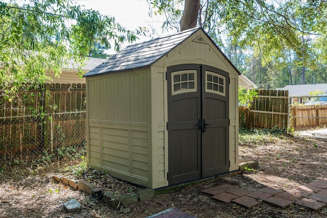 view of shed with a fenced backyard