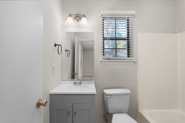 bathroom with toilet and vanity