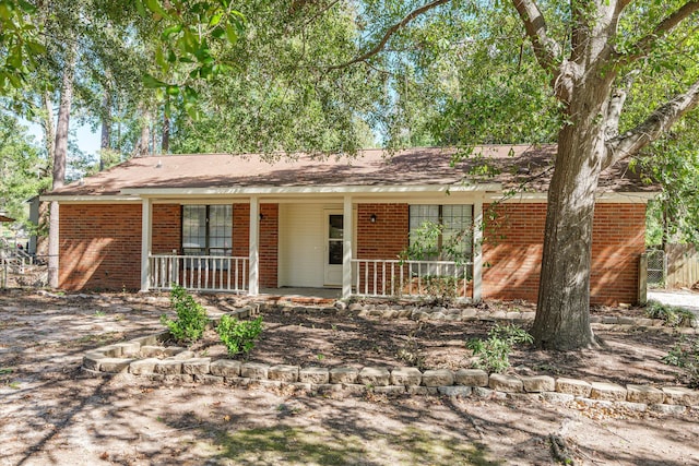 ranch-style house with brick siding and a porch