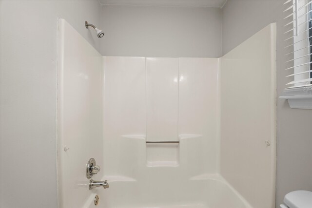 full bathroom with toilet and shower / bath combination