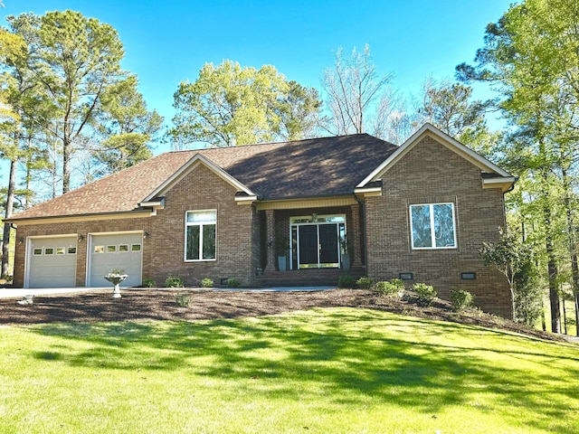 view of front of home featuring a garage and a front yard