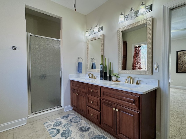 bathroom featuring tile patterned flooring, vanity, and a shower with door