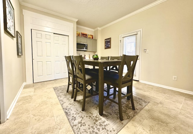 dining space featuring a textured ceiling and ornamental molding