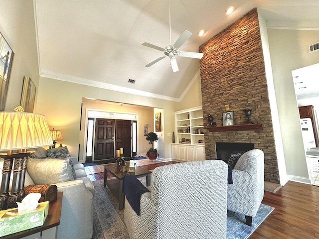 living room featuring dark wood-type flooring, high vaulted ceiling, ceiling fan, built in features, and a fireplace