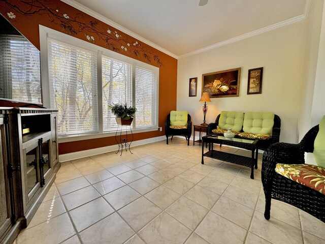 sitting room featuring light tile patterned flooring and ornamental molding