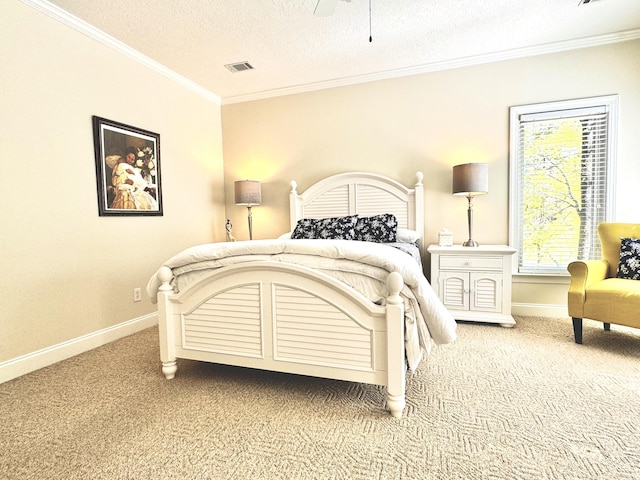 bedroom featuring ceiling fan, crown molding, carpet floors, and a textured ceiling