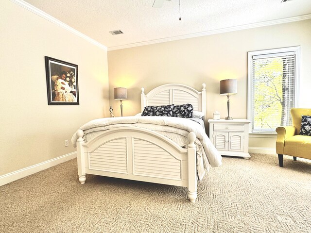 bedroom featuring ceiling fan, crown molding, carpet floors, and a textured ceiling