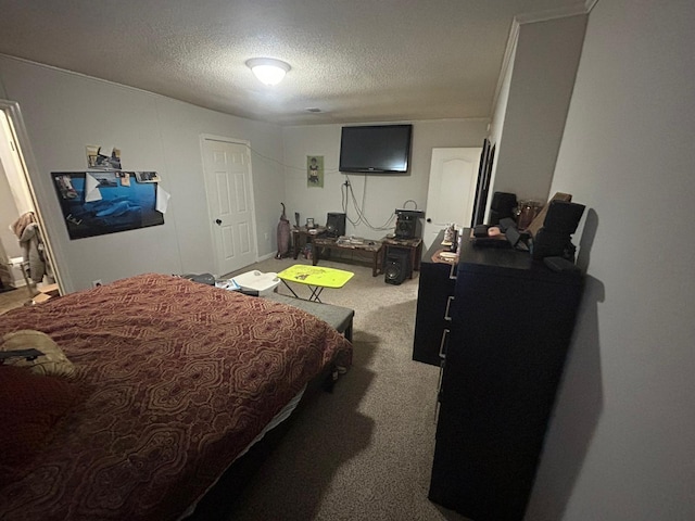 carpeted bedroom featuring a textured ceiling