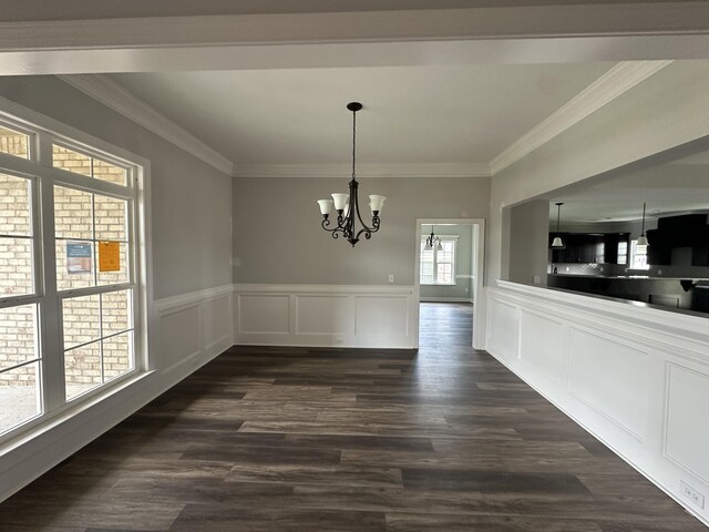 3351 Stockport Dr, Hephzibah, GA 30815 - unfurnished dining area featuring a chandelier, crown molding, dark wood-type flooring, wainscoting, and a decorative wall