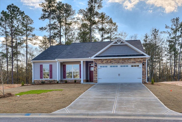 craftsman inspired home featuring stone siding, concrete driveway, and an attached garage