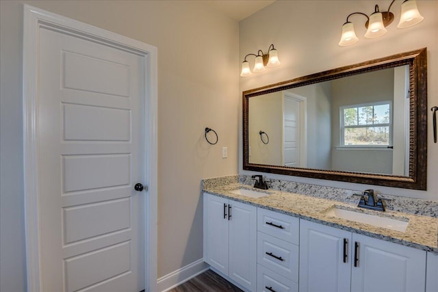 bathroom featuring vanity and hardwood / wood-style floors