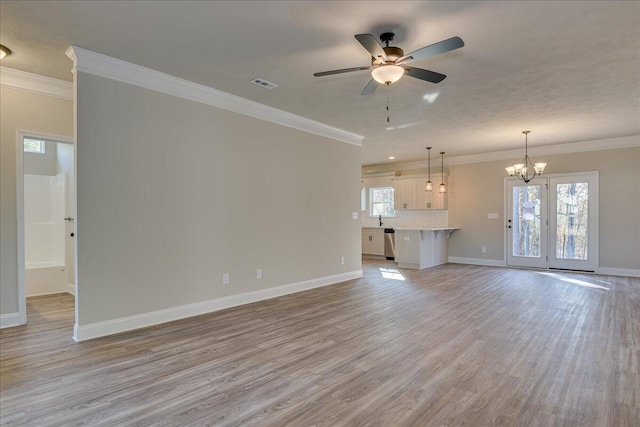 unfurnished living room with ornamental molding, sink, ceiling fan with notable chandelier, and light hardwood / wood-style flooring