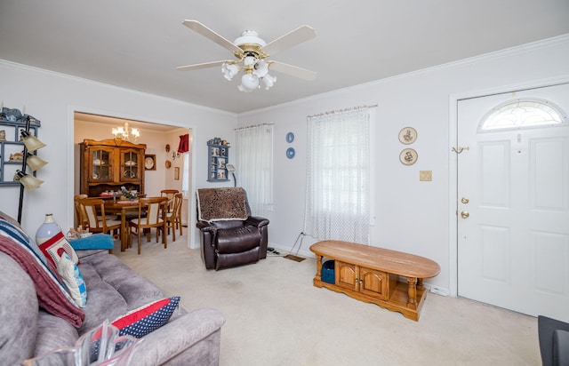 carpeted living room with crown molding and ceiling fan with notable chandelier