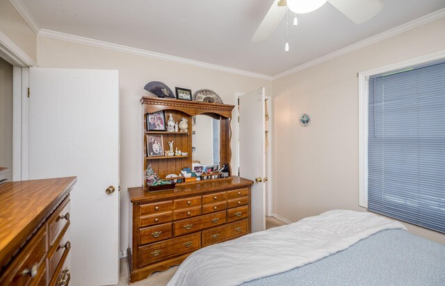 bedroom featuring crown molding and a ceiling fan