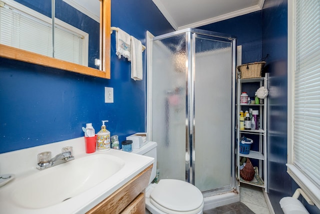 full bathroom featuring vanity, ornamental molding, a stall shower, and toilet