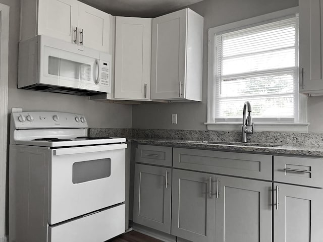 506 Weed St, Augusta, GA 30904 - kitchen with white appliances, stone countertops, gray cabinets, and white cabinetry